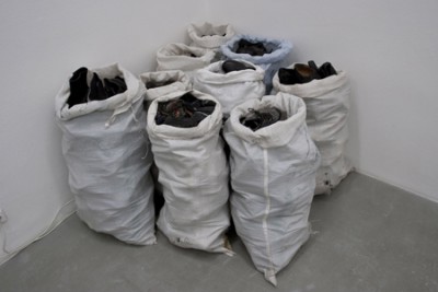 Untitled, large bags containing the number of shoes an average person uses during their lifetime, 2010